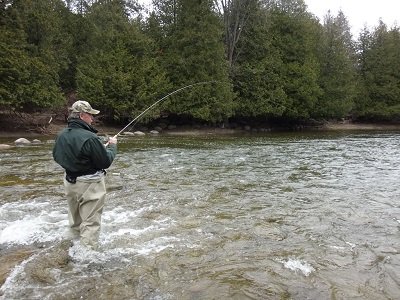 An angler float fishing for trout