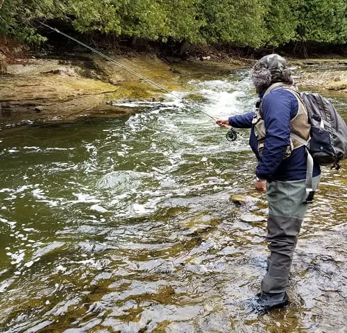 An angler Polish nymphing some faster deep water