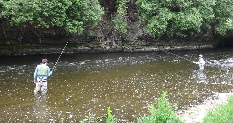 2 anglers fishing the same spot