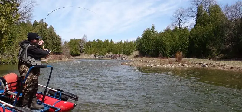 An angler float fishing with flies