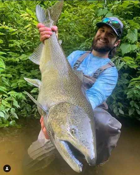 John from Get Bent Guide Service with a massive river salmon. Click the image to see more or to book your trip.