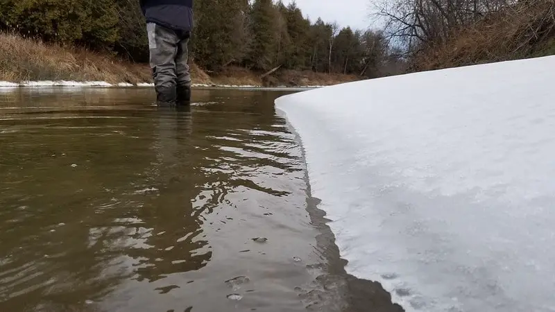 An angler winter steelhead fishing Ohio river