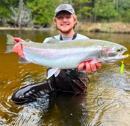 Eli from SBS Outdoor Action with a nice steelhead caught on a lure