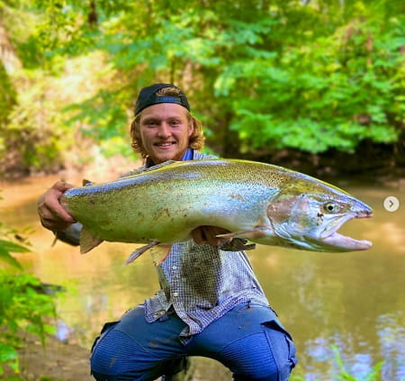 Eli from SBS Outdoors Action with an early August steelhead