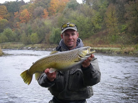 The author with a lake Ontario migratory brown trout.