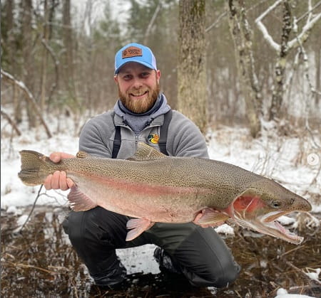 Alex Bialik with  a huge winter Michigan steelhead