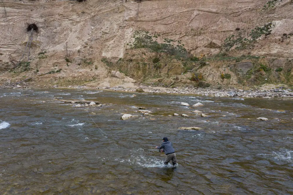 An angler doing some Ontario steelhead fishing on the Saugeen river