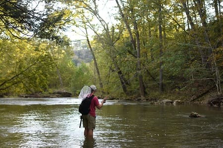 An angler fly fishing one of the .