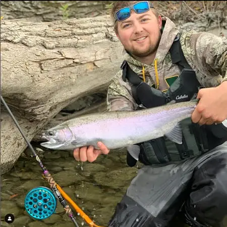 Photographer Dylan with a Centerpin caught steelhead.