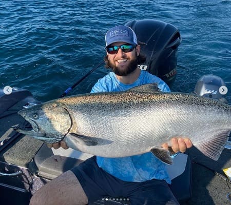 John from Get Bent Guide Service with a massive Lake Michigan salmon. Click the image to see more or to book your trip.