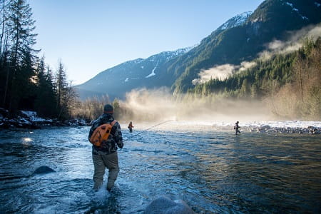 Anglers trout fishing in Alsaka