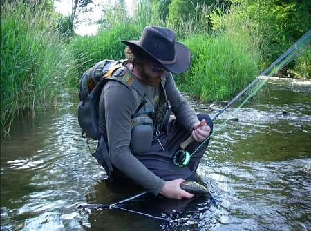 My client with all the trout fishing gear including a good hat and glasses.