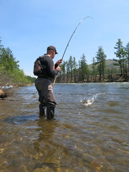 An angler drift fishing for steelhead