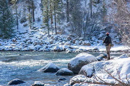 an angler winter steelhead fishing in Ohio