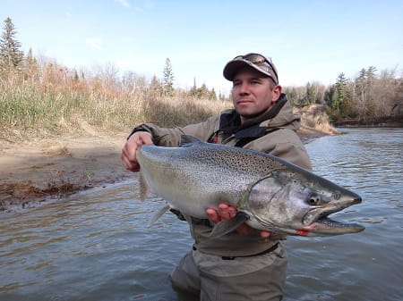 Salmon fishing with leeches can produce large salmon like this one help by my buddy Mike.