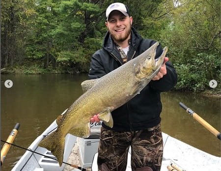 Alex from Fireplug charters with a nice salmon. Guides like John know the best salmon fishing rigs for their area.