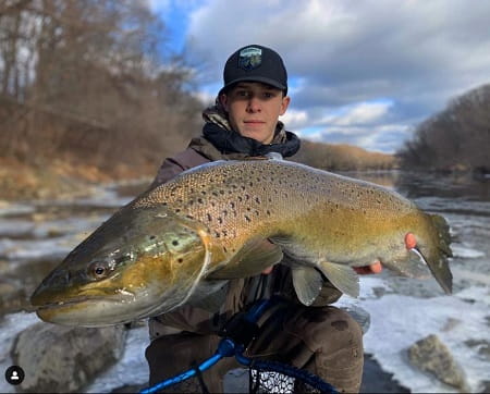 Team photographer Matthew with a massive lake run brown trout. With trout this big you must have good trout fishing rigs.