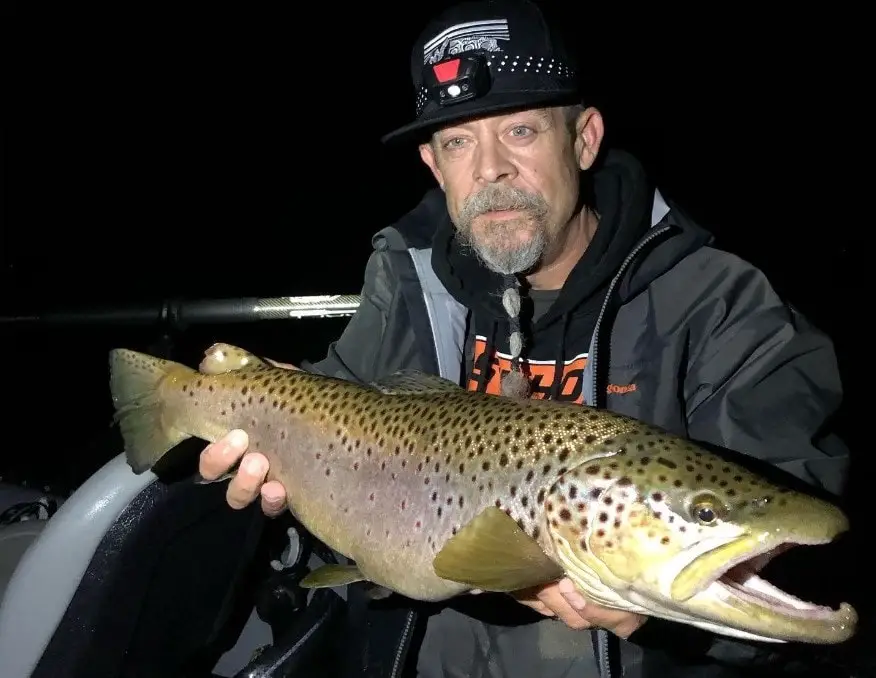 Bill from Wild Bills Guide Service is holding a massive brown trout. Bill is a master at brown trout fishing at night. See more massive brown trout on his Instagram.