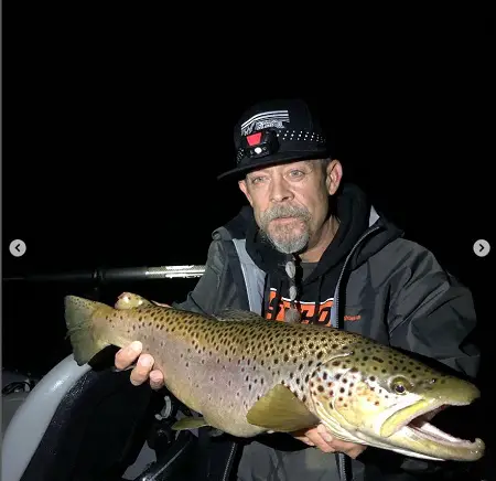 fishing brwon trout at night is a good way to catch massive brown trout like this one.
