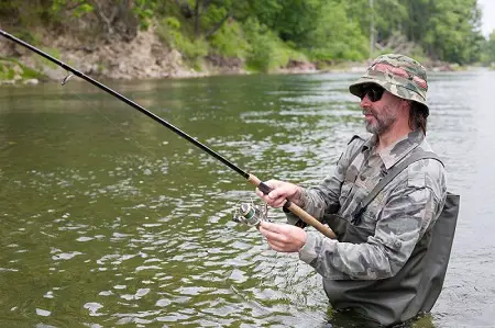 An angler Trout fishing with crankbaits
