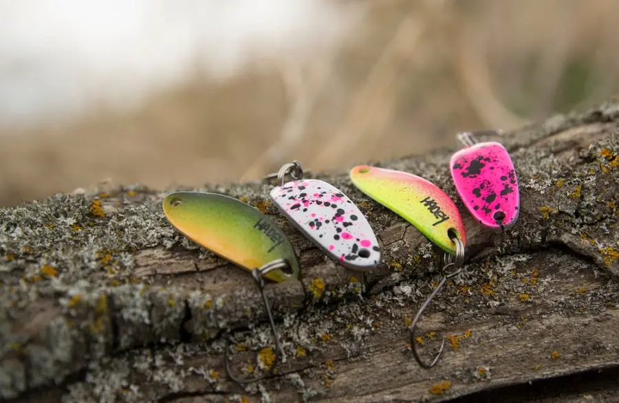 These are 4 colorful spoons used for spoon fishing for salmon.