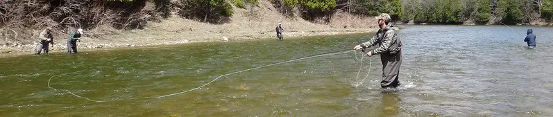 My clients and one of my guides salmon fishing on a larger Ontario salmon river.