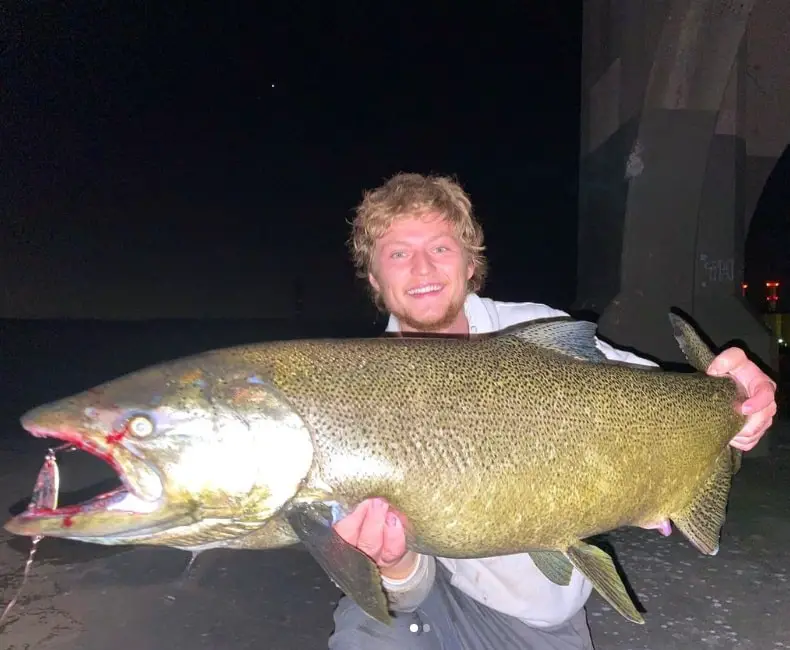 Eli From SBS Outdoor Action Night with a night time spoon caught salmon