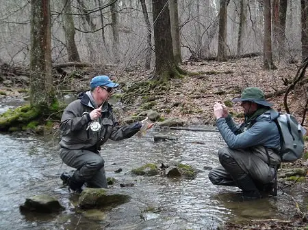 Two guides, wearing two styles of fishing hats