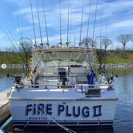 The fireplug charter boat with a dozen salmon trolling rods showing.