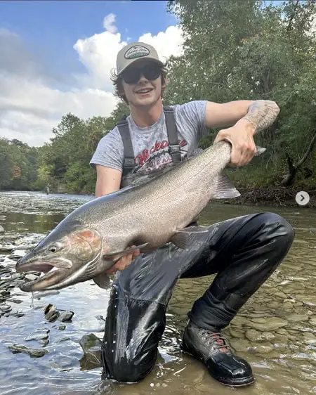 Pennsylvania steelhead guide Dalton with a big steelhead on one of the best Pennsylvania steelhead rivers.