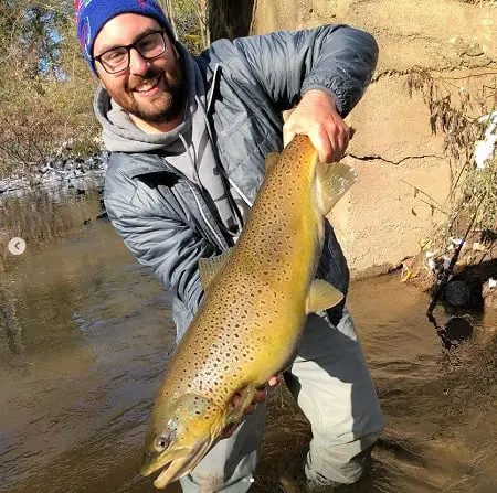 Local guide Andrew from Full Fishing Guide Service in Western New York with a very big lake run brown trout.