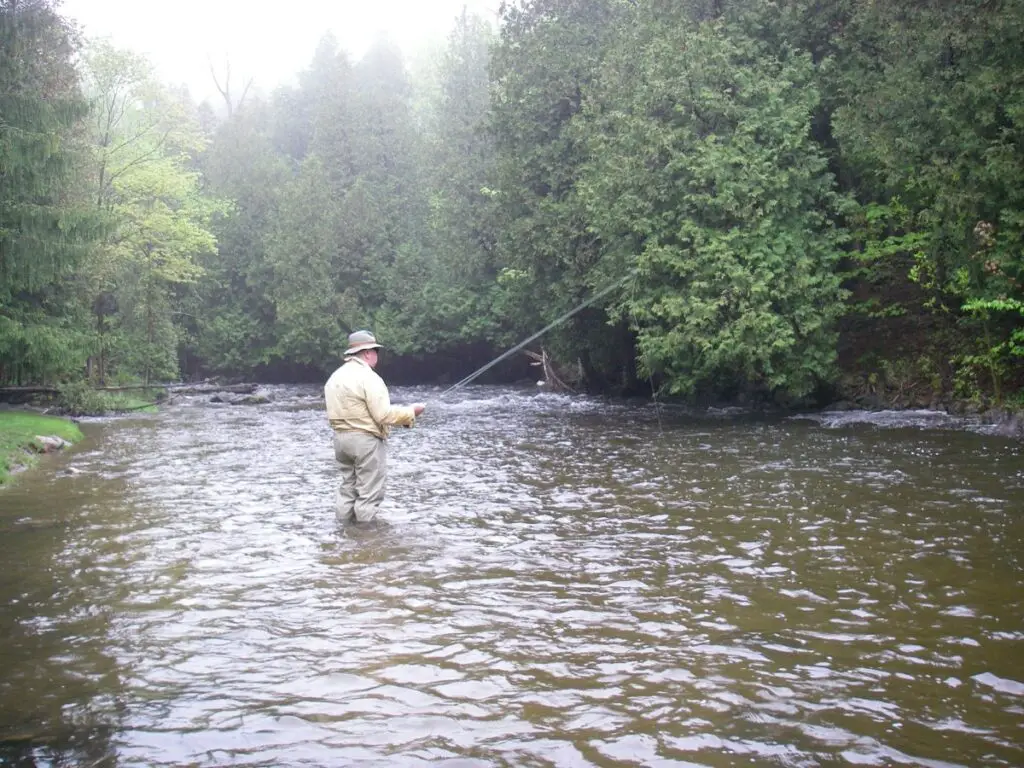 An angler with a 9 foot rod.