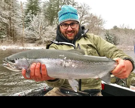 New York guide Andrew Full from Full Fishing Guide Service holding a nice steelhead caught fishing from a drift boat near Pulaski, NY.